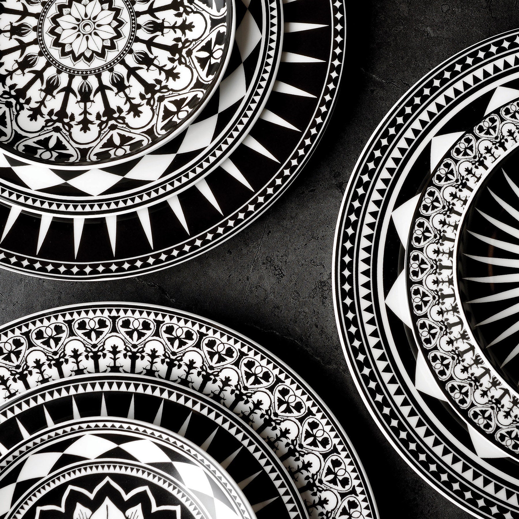 Black and white plates with designs on them.