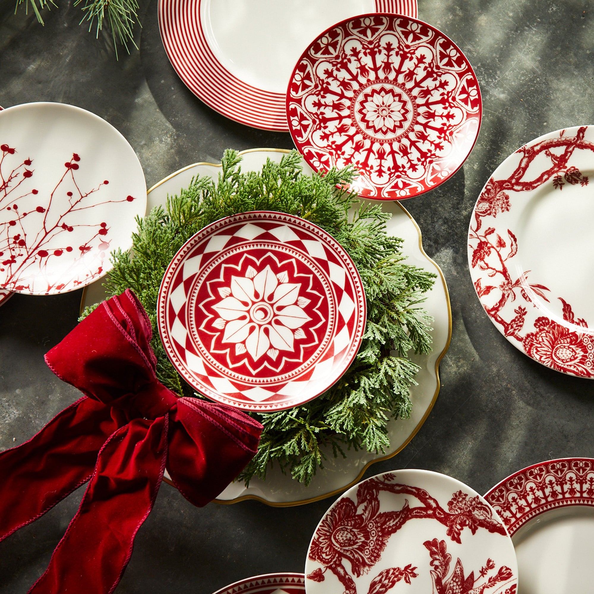 A group of plates with red and white designs.