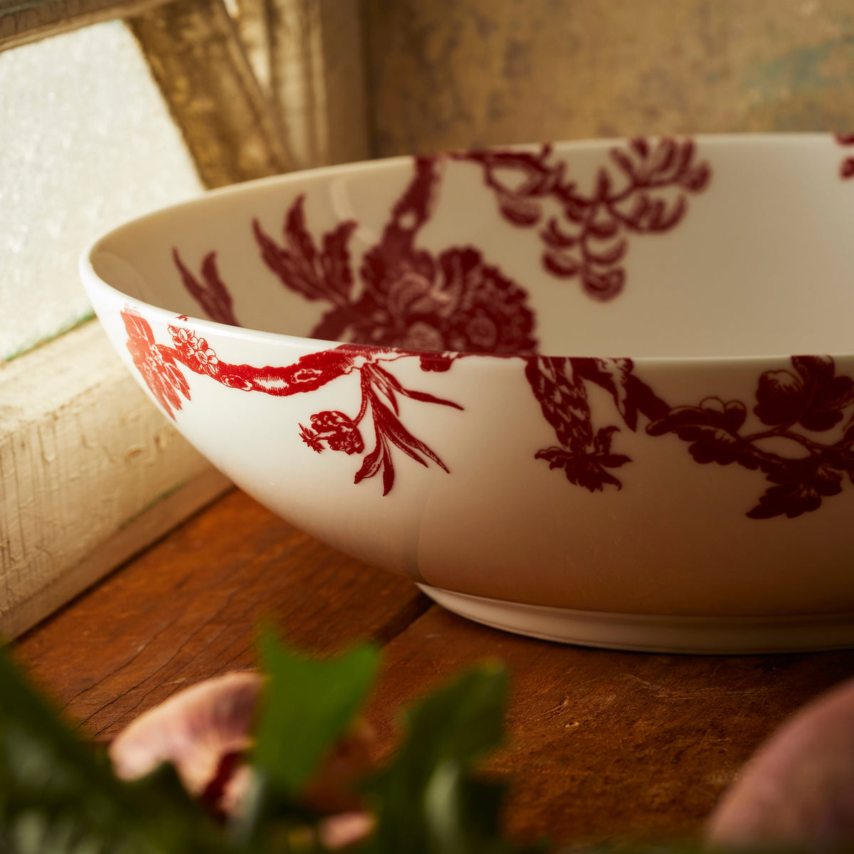 A detail photo showing the floral pattern of the Arcadia Wide Serving Bowl by Caskata.
