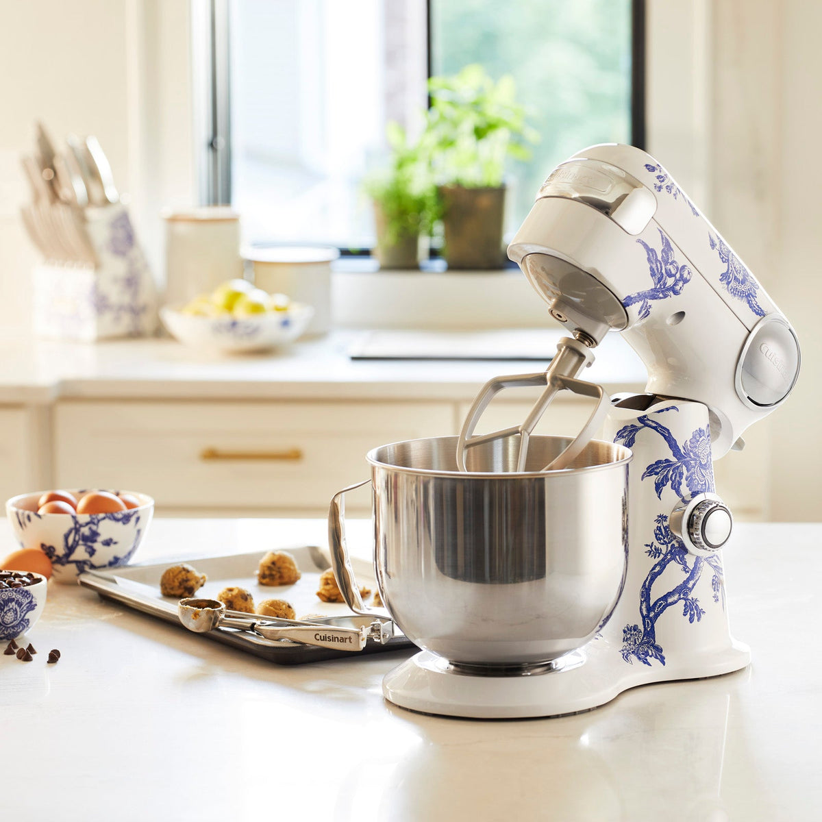 A Caskata X Cuisinart Limited Edition Arcadia Performance Stand Mixer on a kitchen counter.