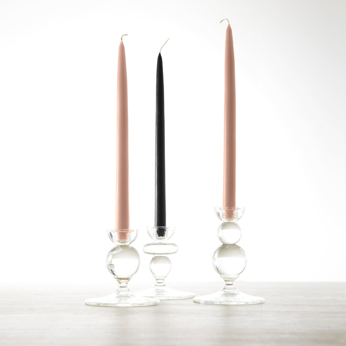 Three Floral Society 12&quot; Black Taper Candles - Set of 2 with tapers on a table.
