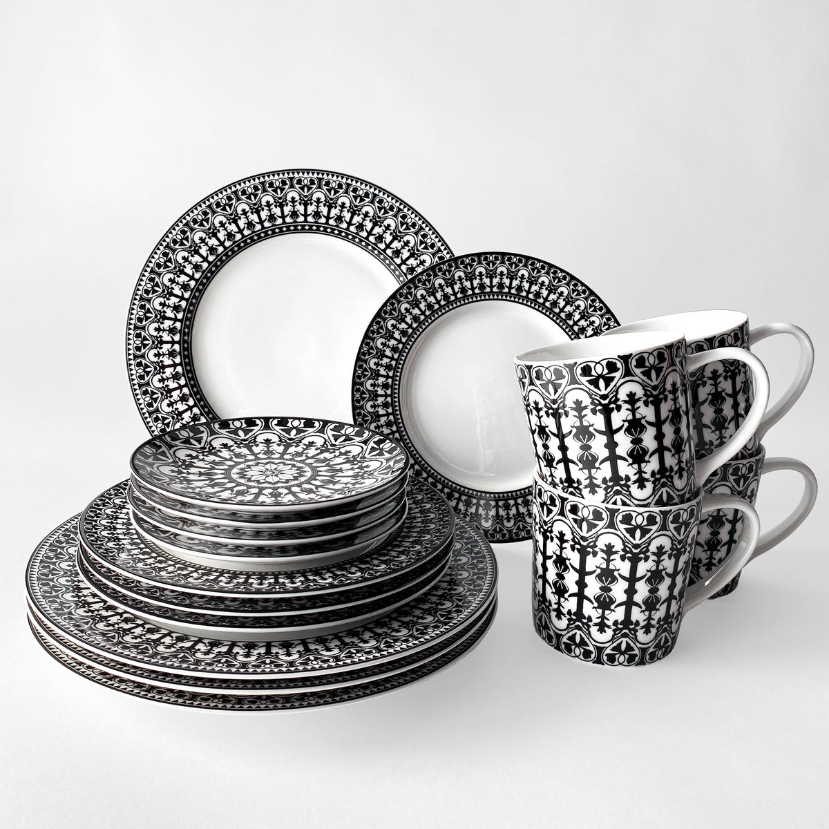 Description: The Casablanca Canapé Plates from the Caskata Artisanal Home Geometrics Collection, showcasing a stunning combination of black and white, elegantly displayed on a pristine white surface.
