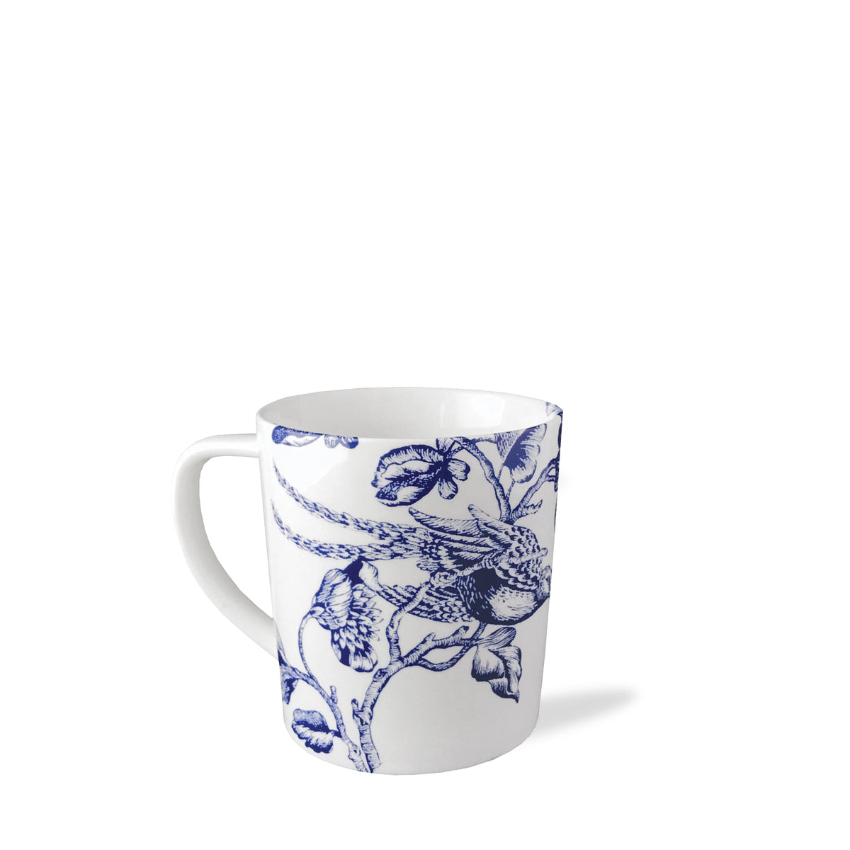 White ceramic mug with a blue floral and bird pattern, reminiscent of Chinoiserie Toile, displayed on a white background. Introducing the Chinoiserie Toile Mug by Caskata Artisanal Home.