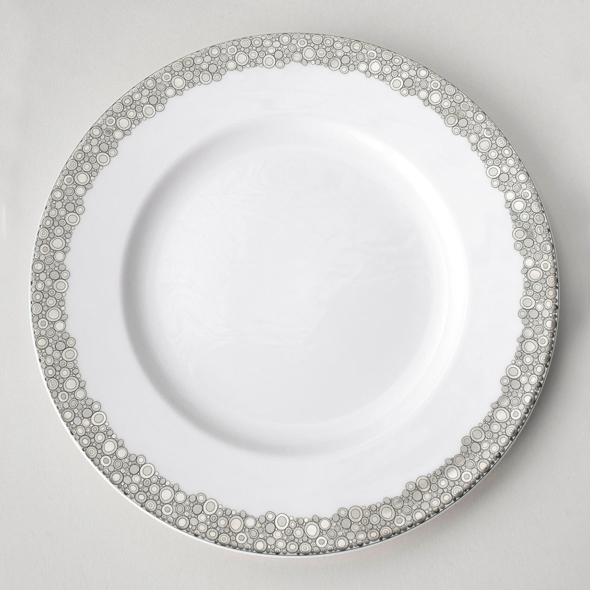 An Ellington Shine Platinum Simple dinner plate with a silver trim from Caskata Artisanal Home.