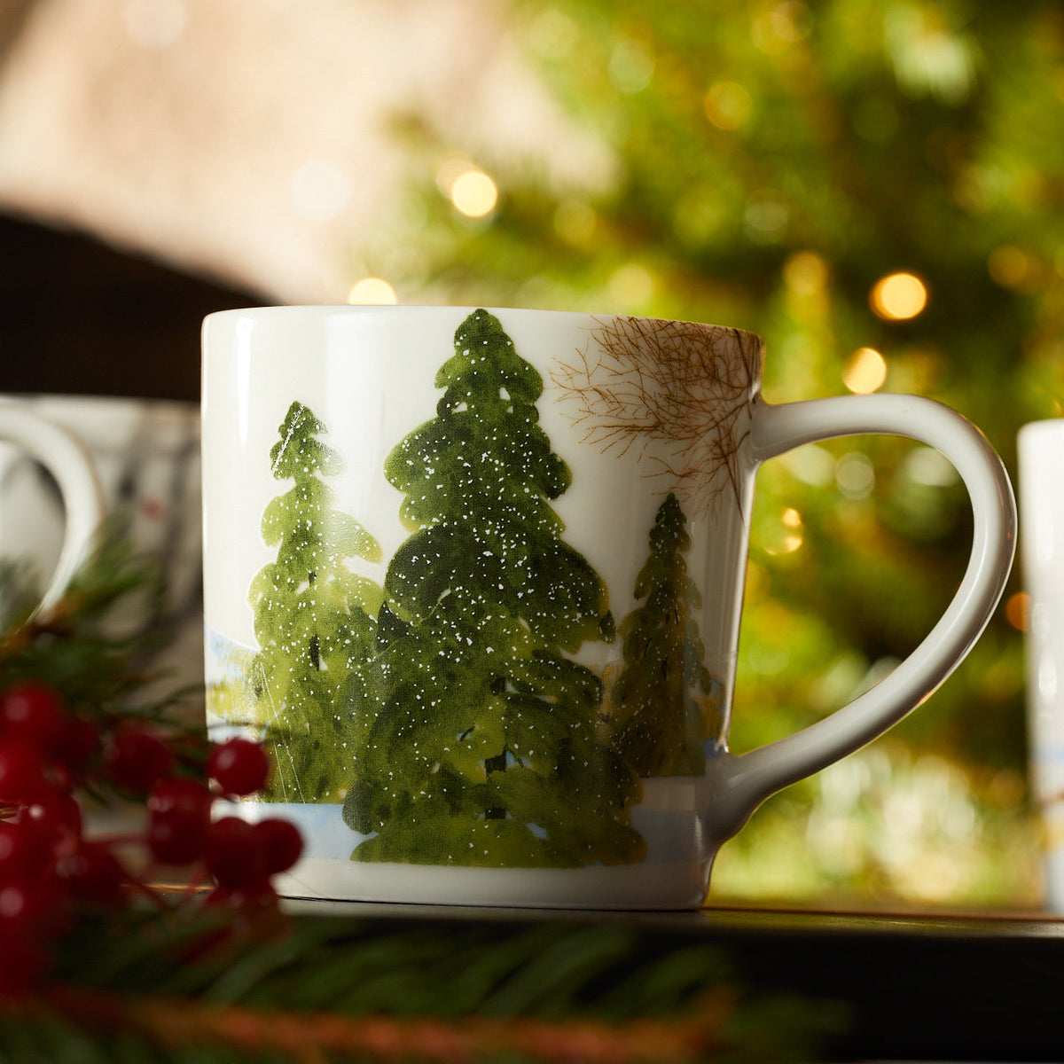 A close up of the snow covered pine trees on one of the Caskata X Felix Dolittle Winter Collaboration Porcelain Mugs Set of 4
