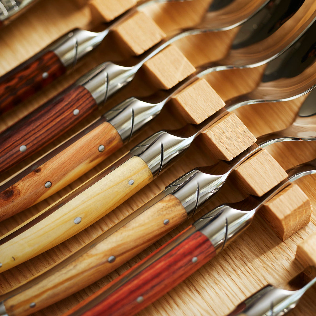 Close-up photo of spoons Goyon-Chazeau Mixed Wood Flatware Boxed 24-Piece Set