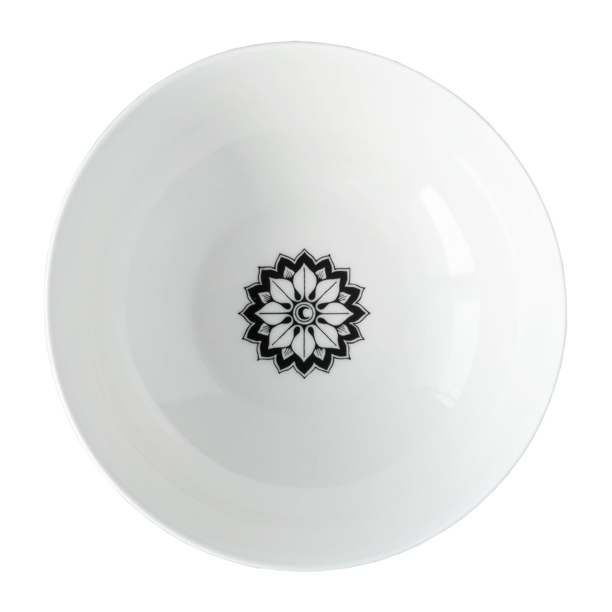A white Marrakech Vegetable Serving Bowl with a black flower design on it from the Caskata Artisanal Home Geometrics Collection.