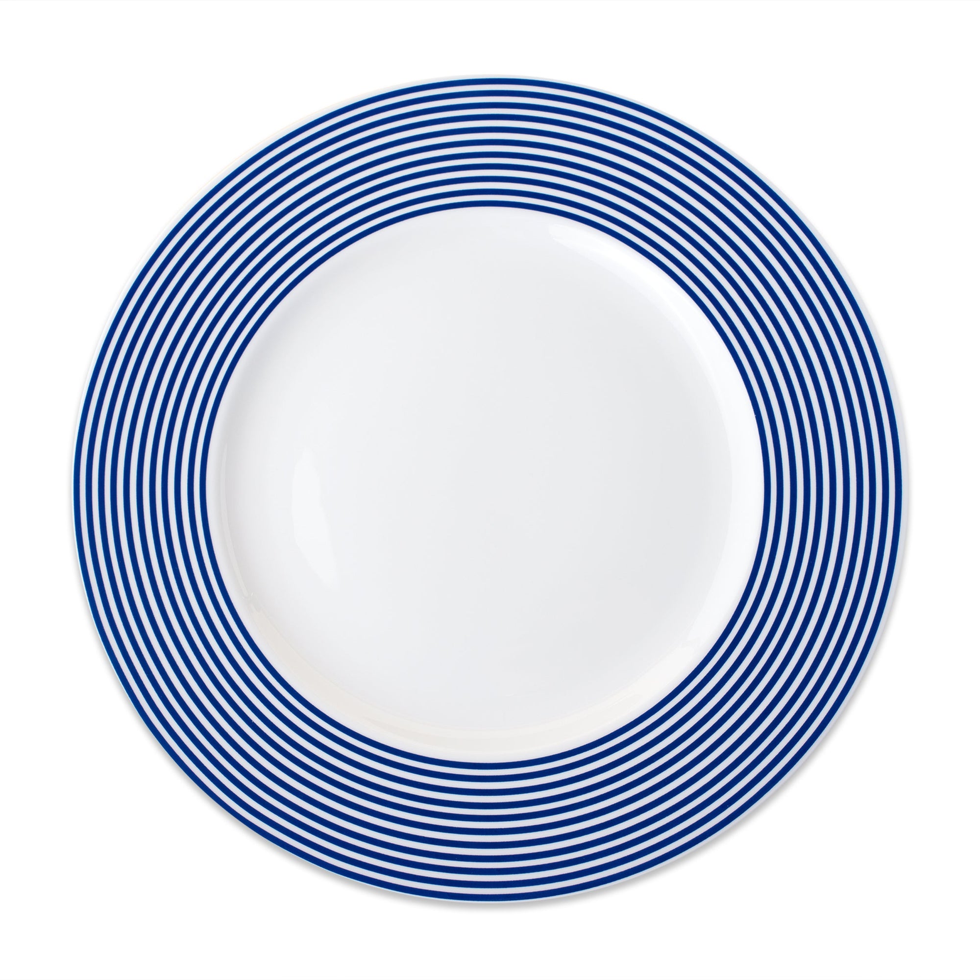 A Newport Racing Stripe Rimmed Dinner Plate from Caskata Artisanal Home, featuring blue and white stripes on a white background with porcelain layers.