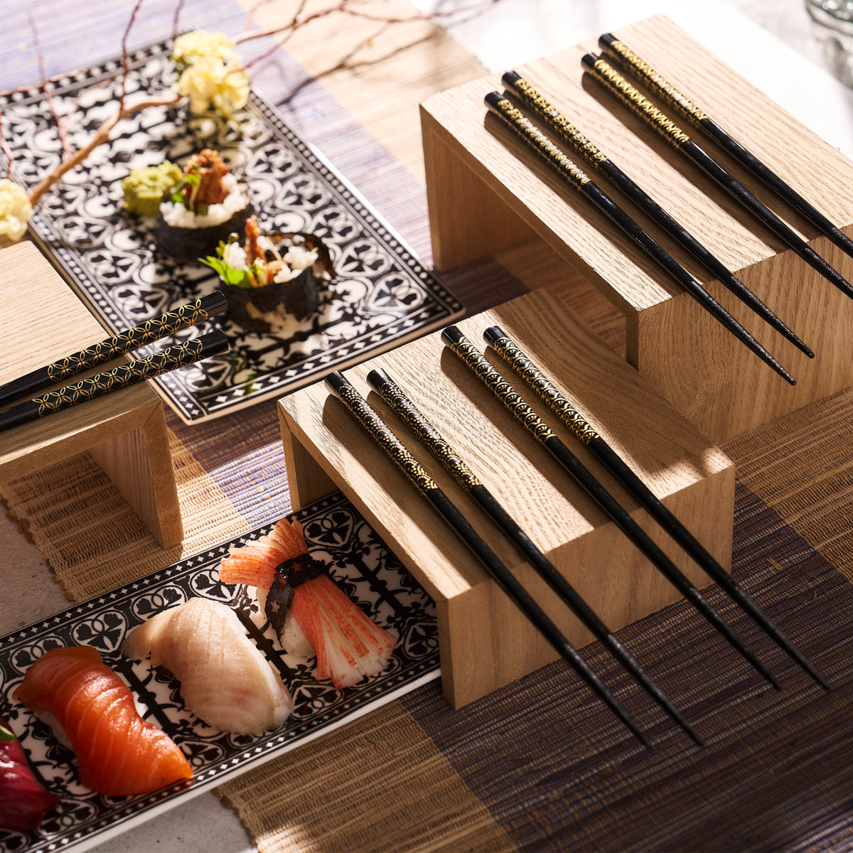 Lacquered wooden tray with Osaka Chopsticks featuring gold patterns by Miya, Inc.