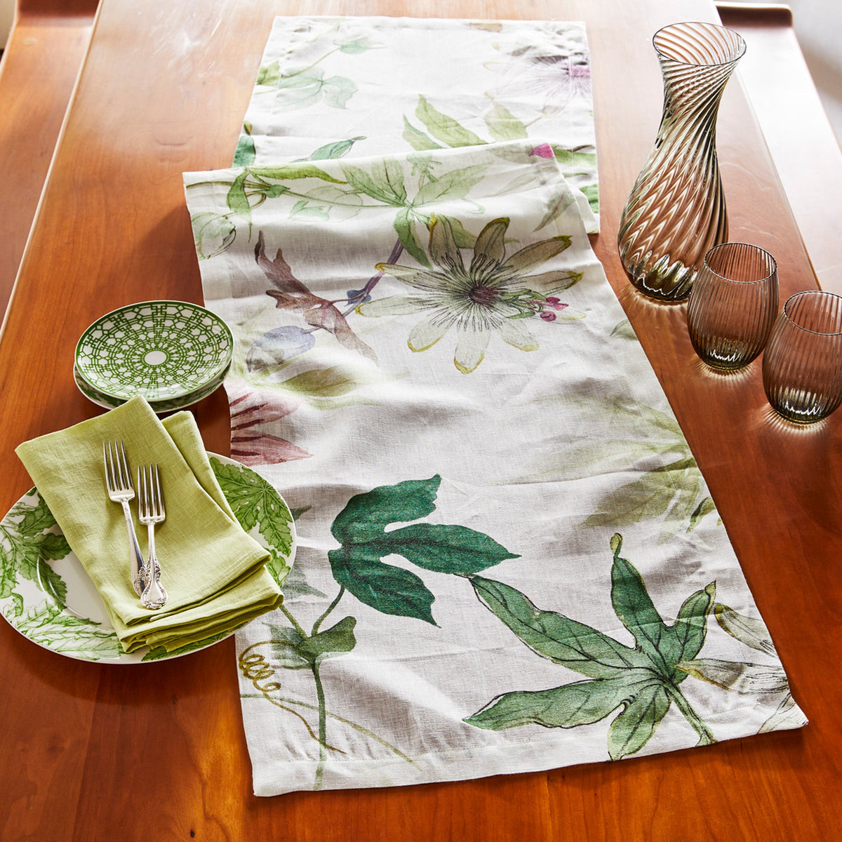A Passionflower Linen Table Runner with green passionflowers by TTT.