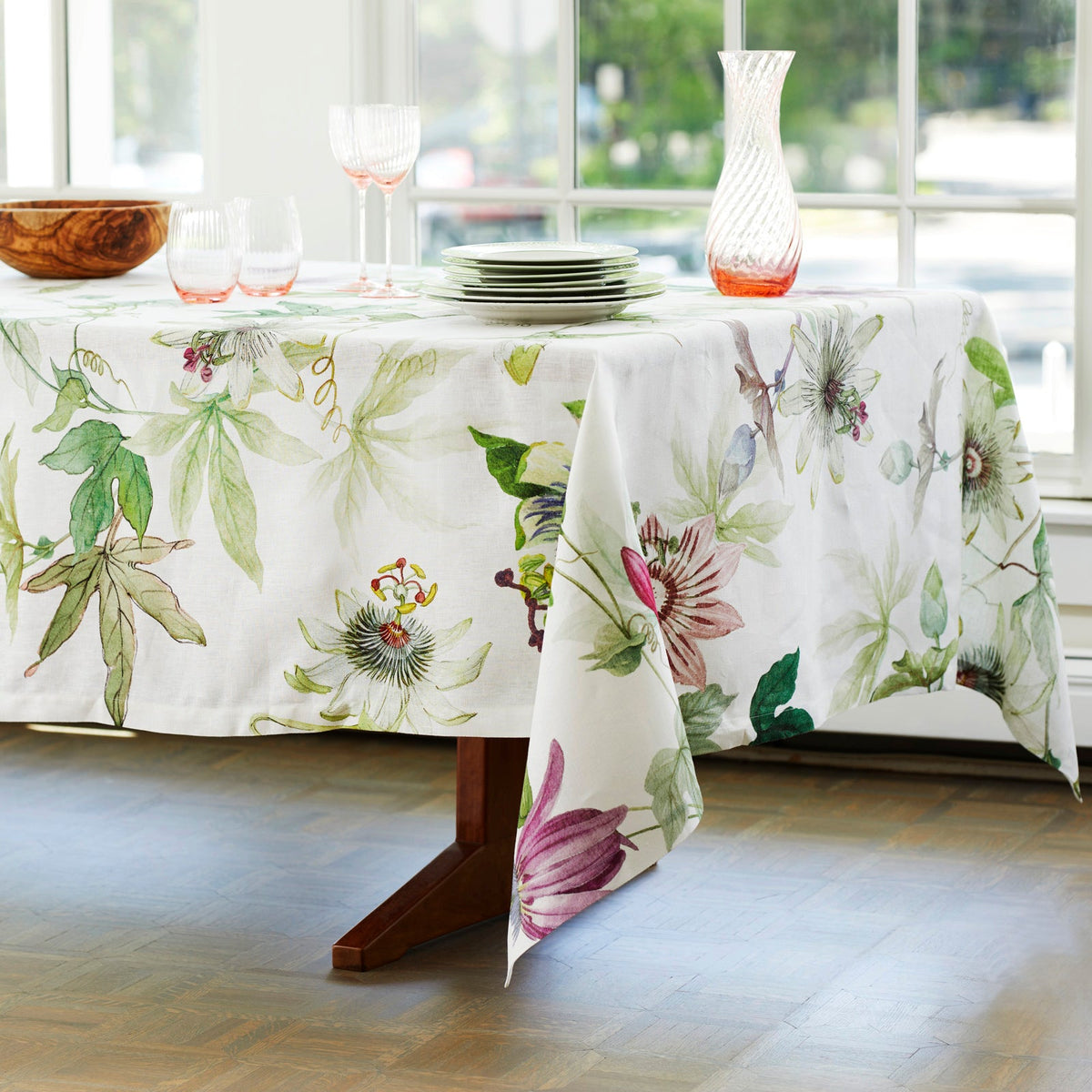 A Passionflower Linen Tablecloth adorned with TTT.