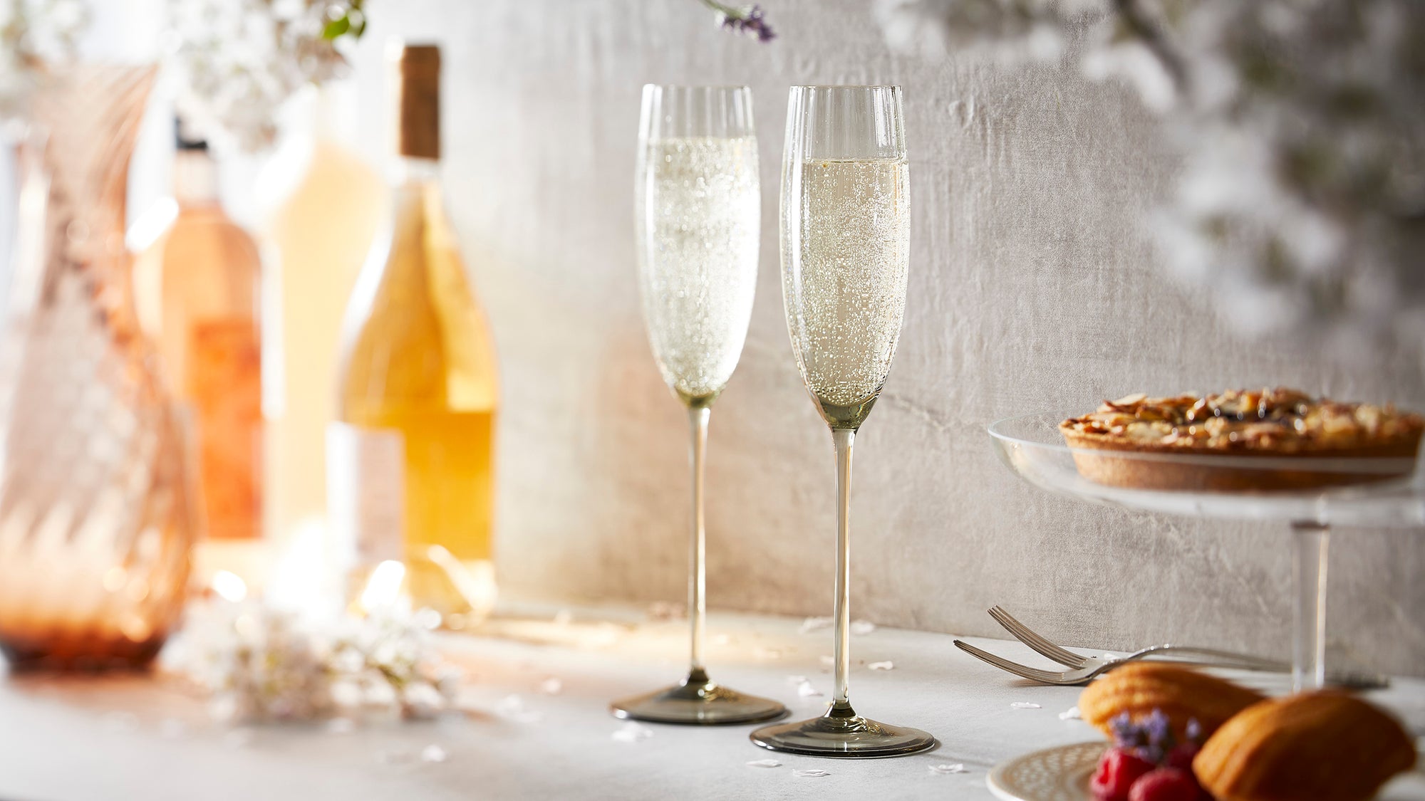 Quinn Crystal Smoke Champagne Flutes in a Wedding Setting From Caskata