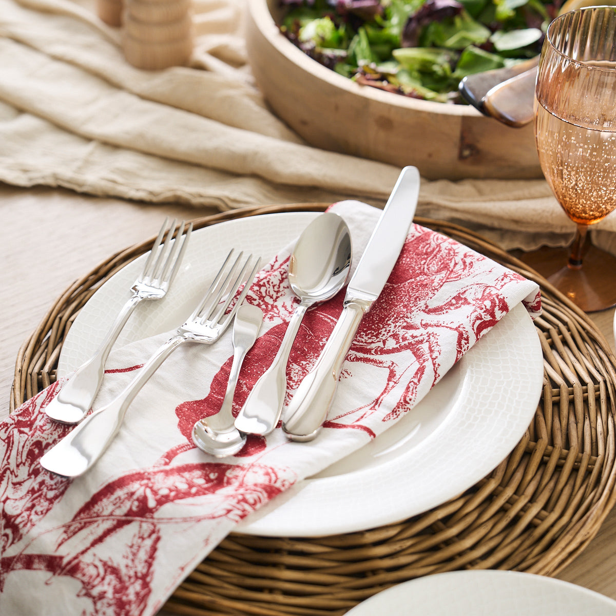 A contemporary design Viol 5-Piece Place Setting napkin in red and white by Degrenne.