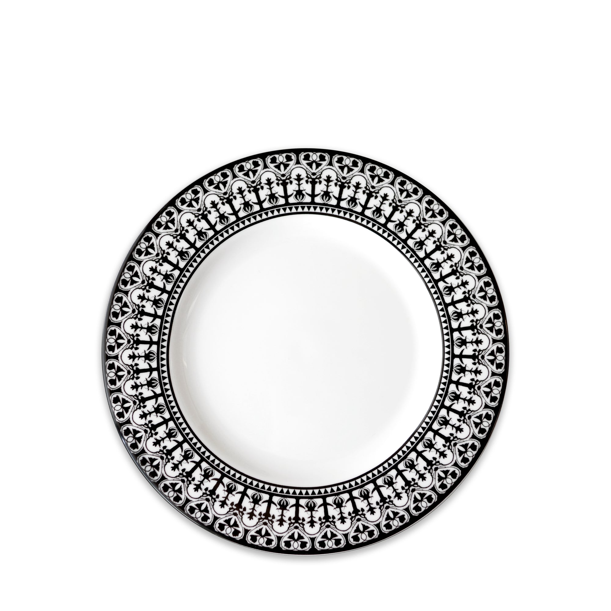 A round, white porcelain plate with an intricate black and white patterned border, part of the elegant Casablanca Rimmed Salad Plate collection by Caskata Artisanal Home.