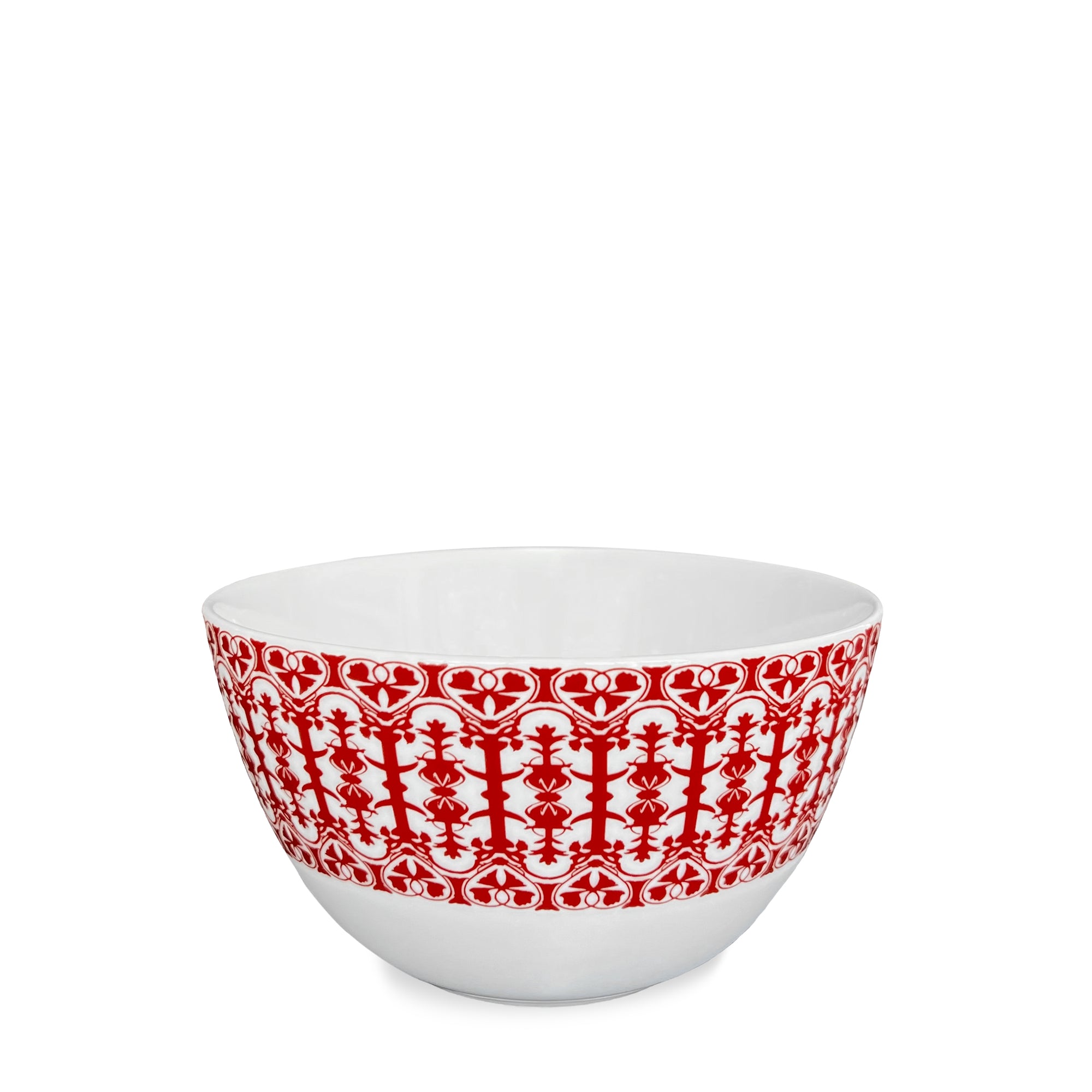 A high-fired porcelain bowl featuring an intricate red pattern around its exterior, embodying the charm of Caskata's Casablanca Crimson Cereal Bowl.