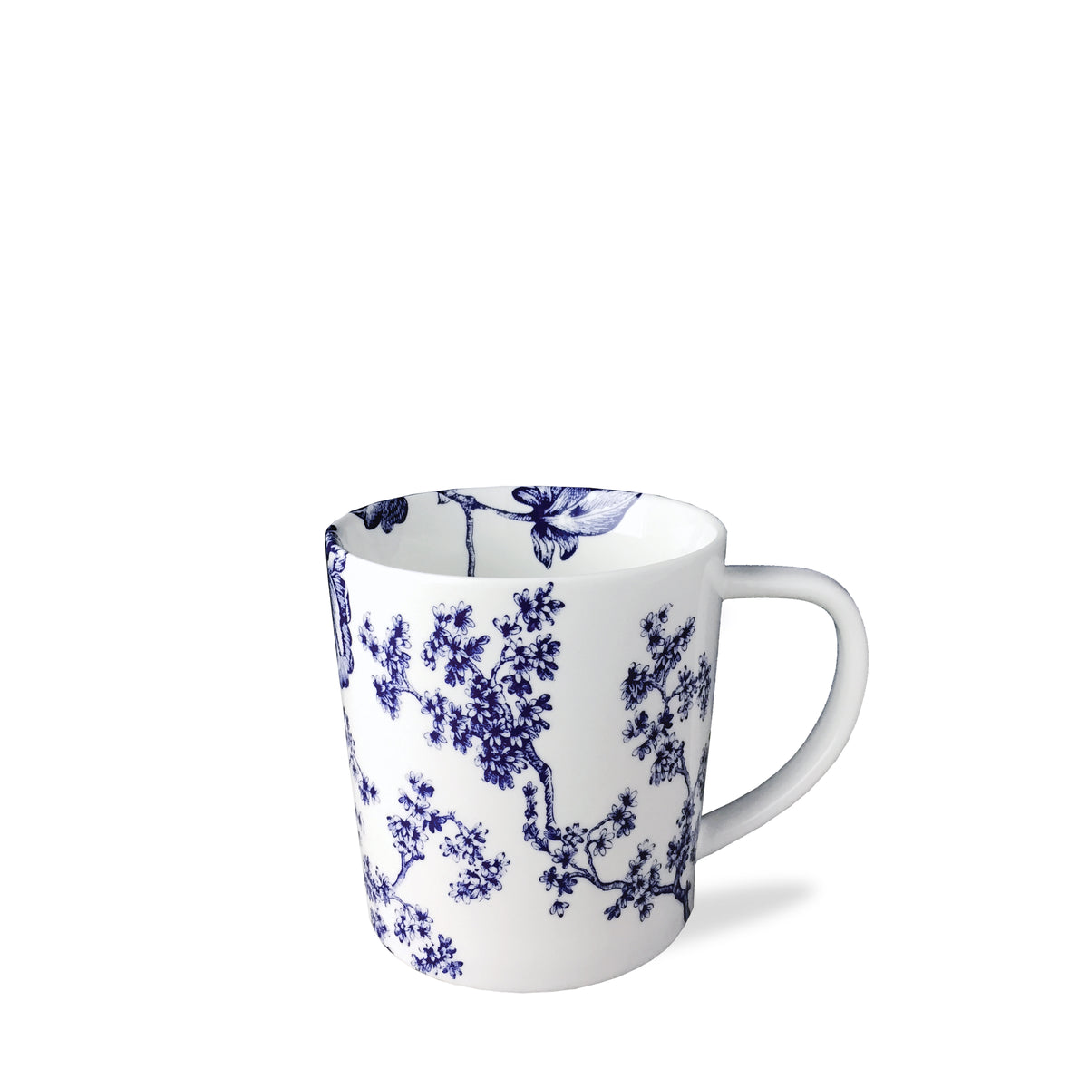 A Chinoiserie Toile Mug by Caskata Artisanal Home with a handle featuring blue floral patterns, exuding timeless elegance reminiscent of Chinoiserie Toile.