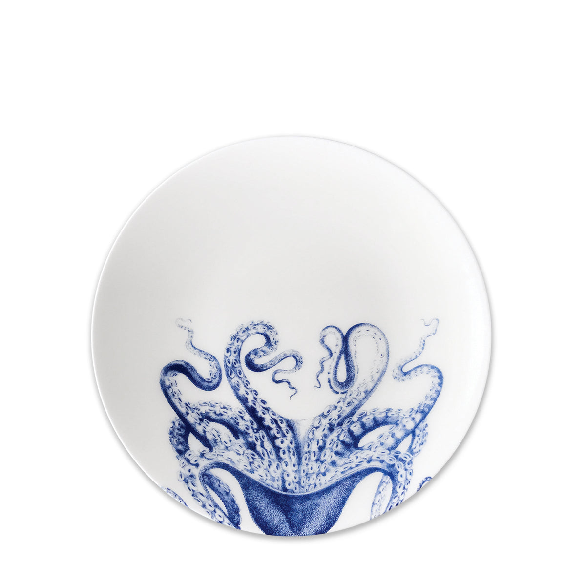 A white **Lucy Coupe Salad Plate** with a detailed blue illustration of an octopus at the bottom, crafted from creamy white premium porcelain. Its contemporary shape adds a modern touch, and it&#39;s both dishwasher and microwave safe for added convenience from **Caskata Artisanal Home**.