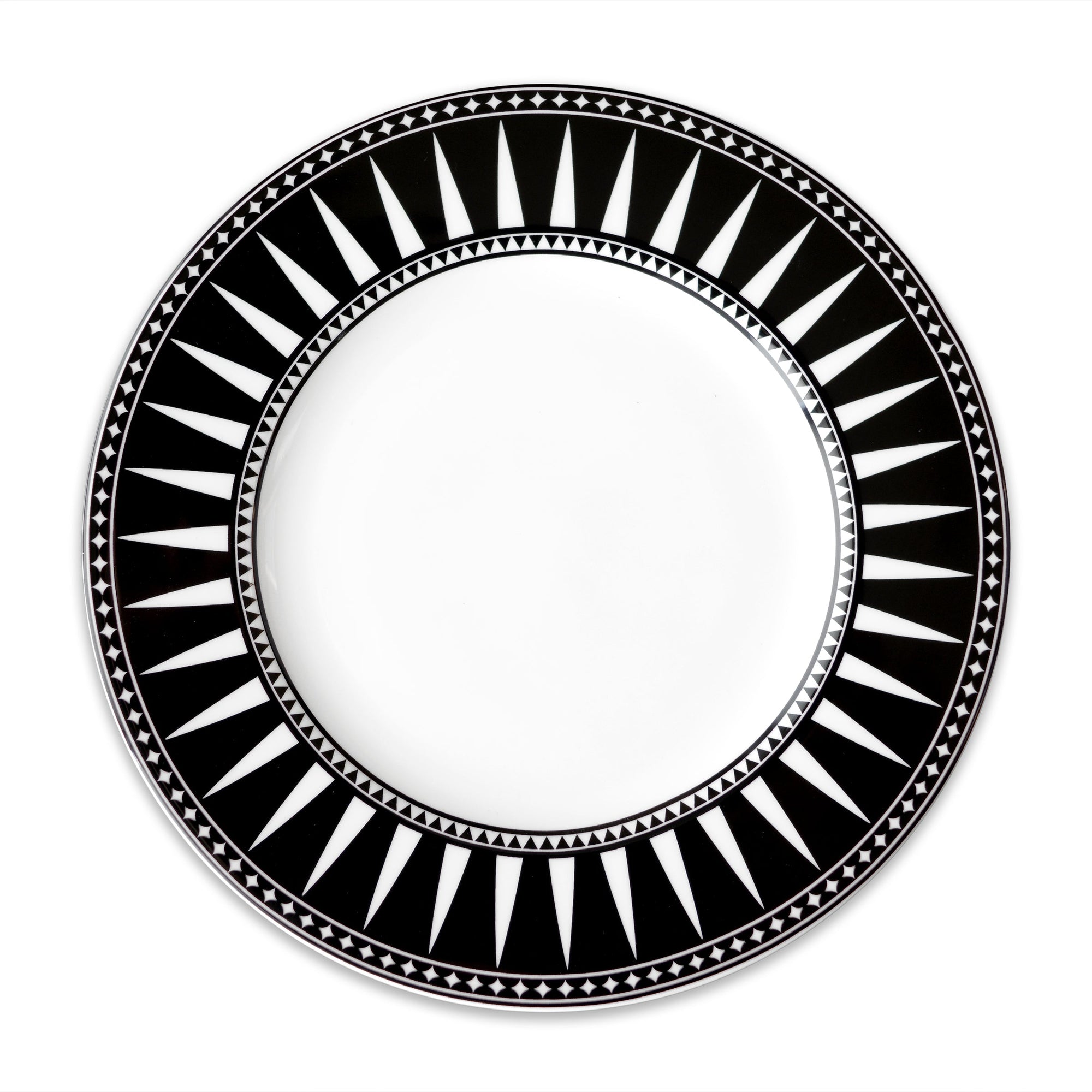 A round white plate with a black rim features a sophisticated geometric pattern of triangles and lines in white, reminiscent of the Marrakech Rimmed Dinner Plate by Caskata Artisanal Home.