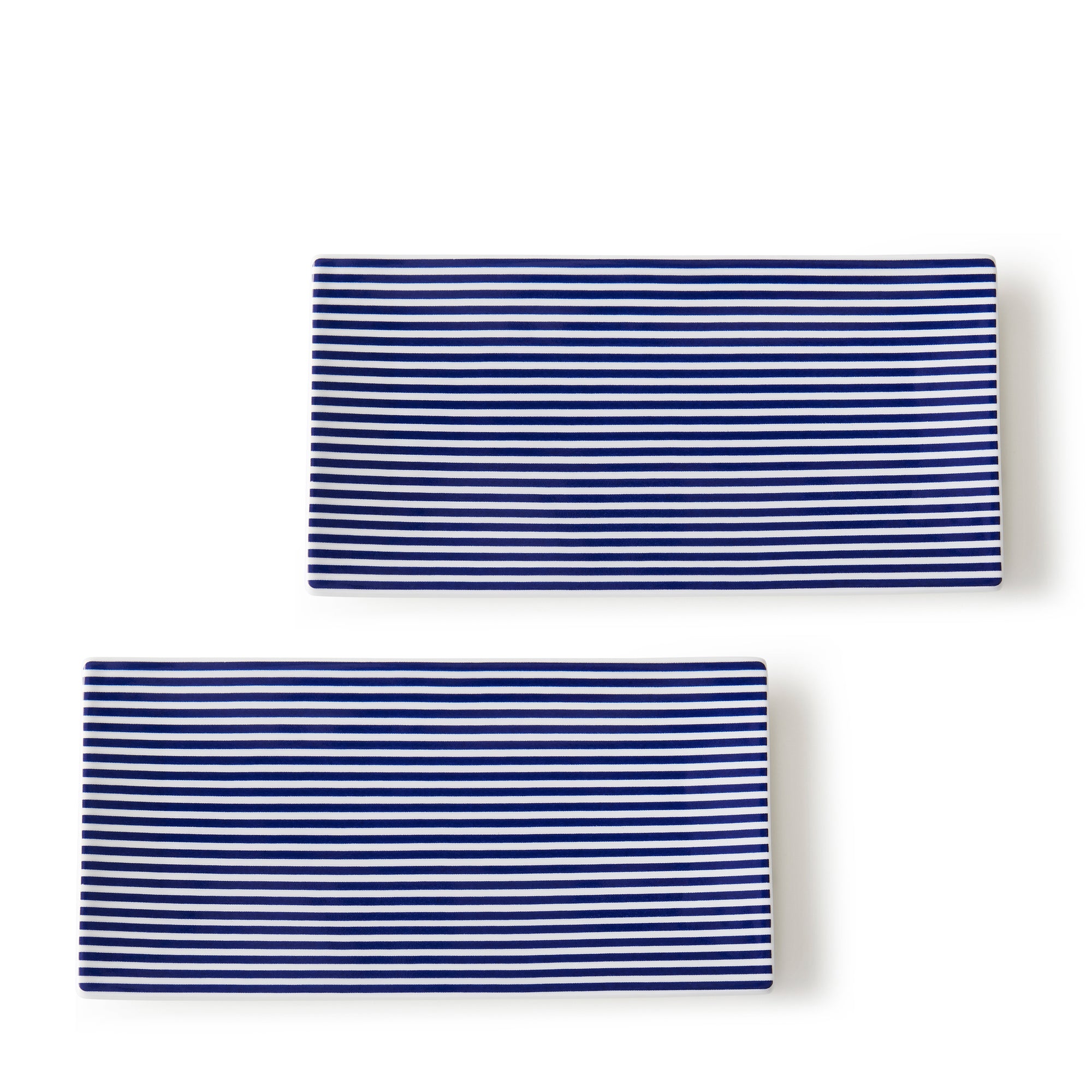 Two rectangular folded Newport Medium Sushi Trays, Set of 2 by Caskata with Newport Stripe blue and white horizontal patterns on a plain white background, adding a touch of casual elegance perfect for any setting.