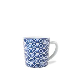 A creamy white Newport Garden Gate Mug by Caskata Artisanal Home, delicately adorned with a blue geometric pattern, features a handle on the right side. This graphic mug is both dishwasher and microwave safe, ensuring convenience and style in your daily routine.