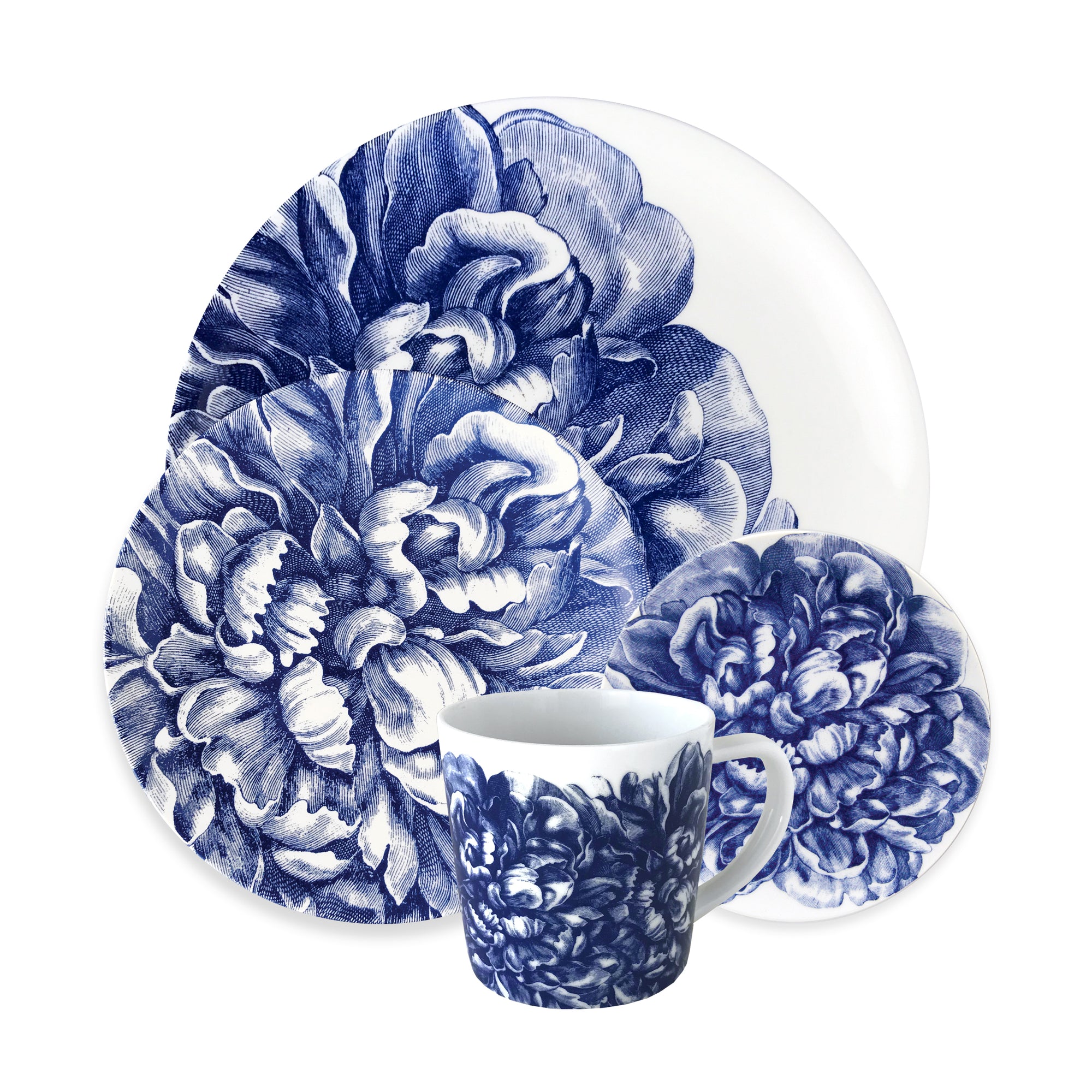 A set of Caskata Artisanal Home Peony 4-Piece Place Setting with a blue floral design, including two plates of different sizes and a small cup, all on a white background.