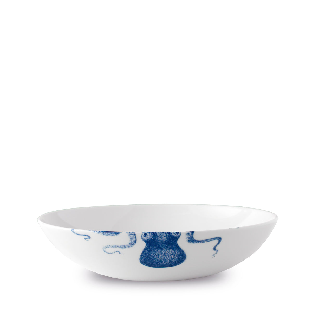 White high-fired porcelain Lucy Entrée Bowl by Caskata Artisanal Home with a blue octopus design on the exterior.