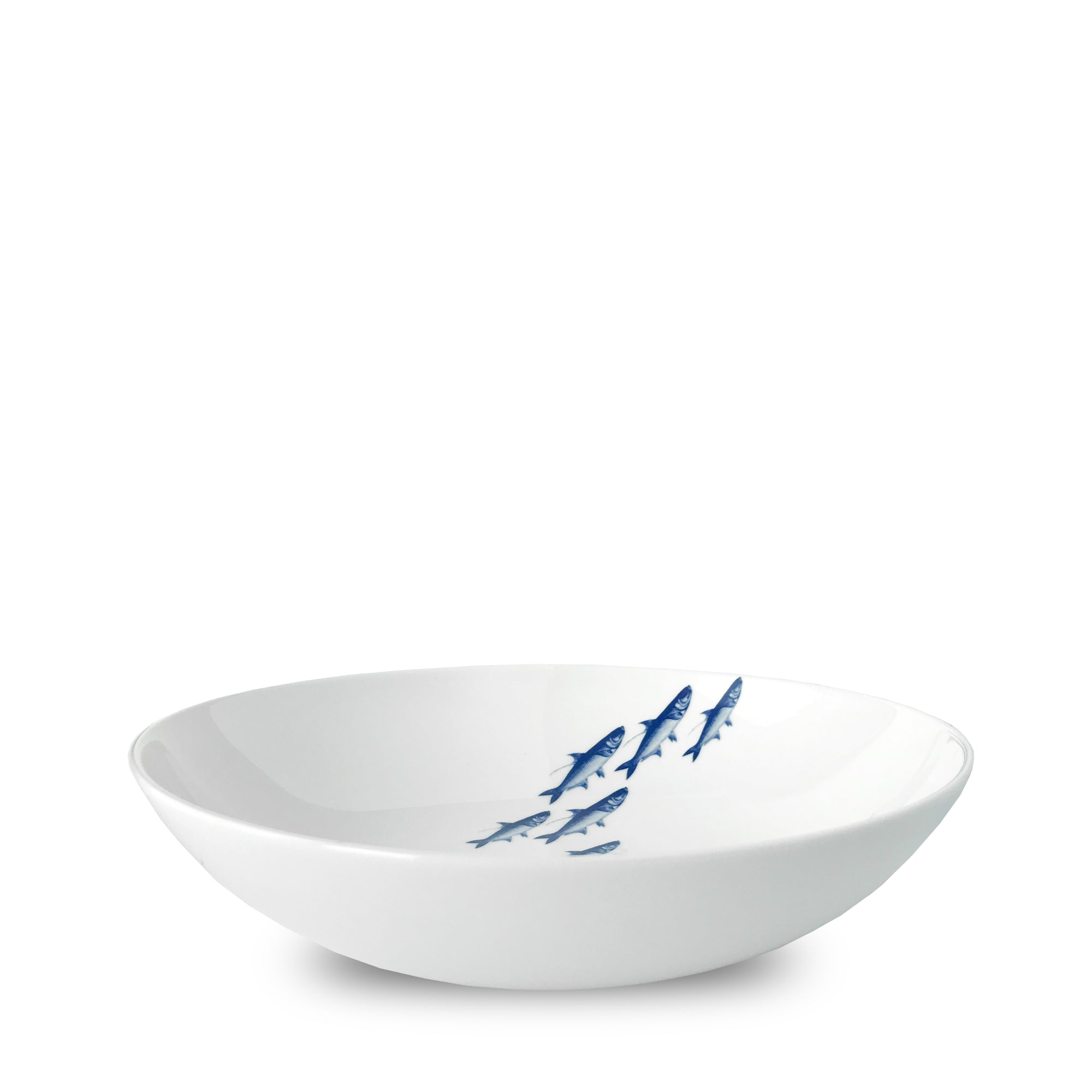 A Caskata Artisanal Home School Fish Entrée Bowl, decorated with a school of blue fish in the center, perfect for any dinnerware collection.