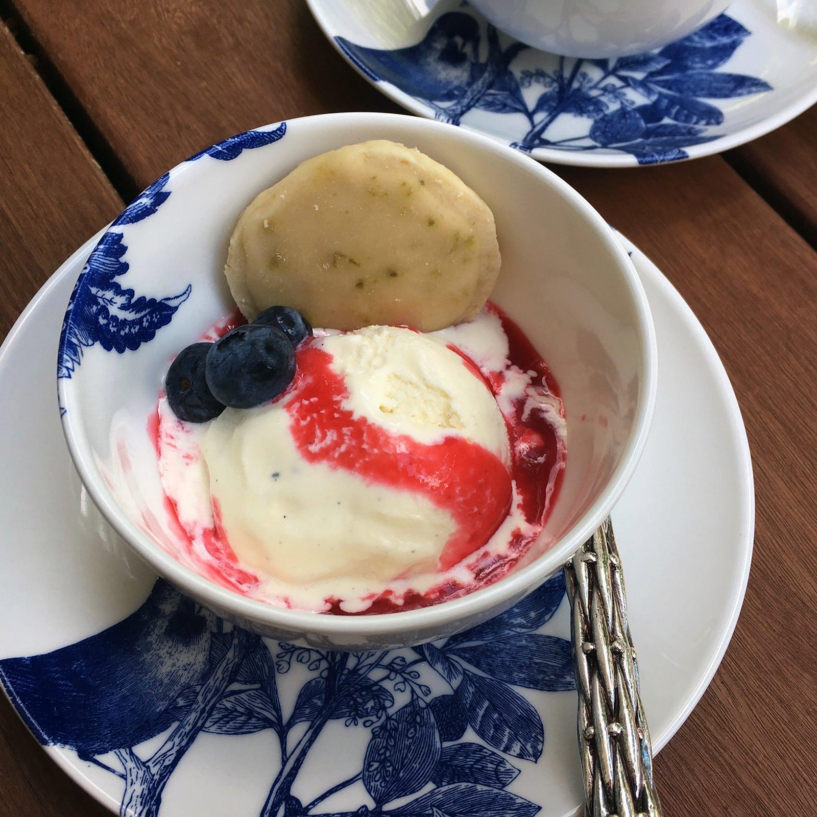 lime shortbread cookie with vanilla gelato and raspberry coulis in Caskata Arbor Snack Bowl and Blue Arbor with Birds Canape Plate