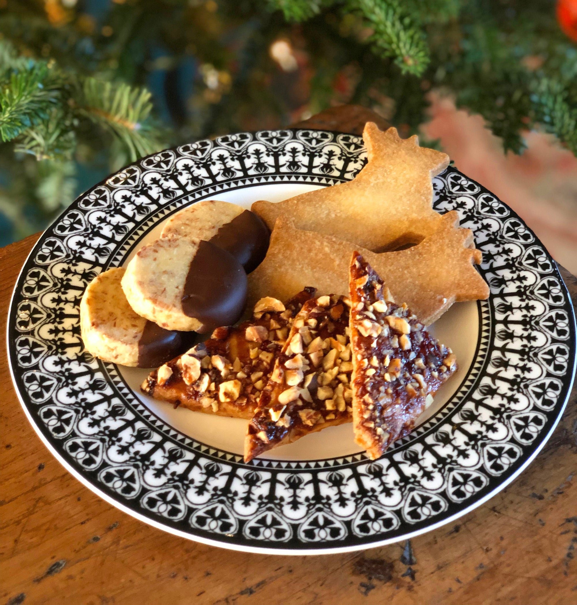 Butter cookies, raspberry hazelnut cookies, coconut cookies dipped in chocolate, Christmas cookies on a Casablanca Salad Plate