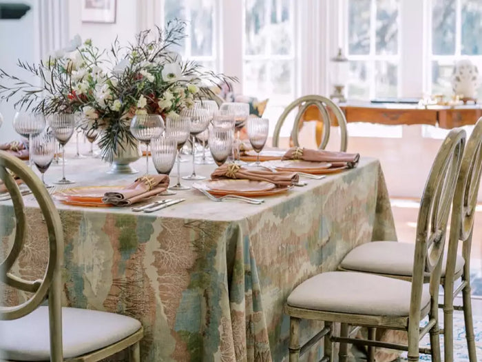 Elegant dining table styled with patterned tablecloth