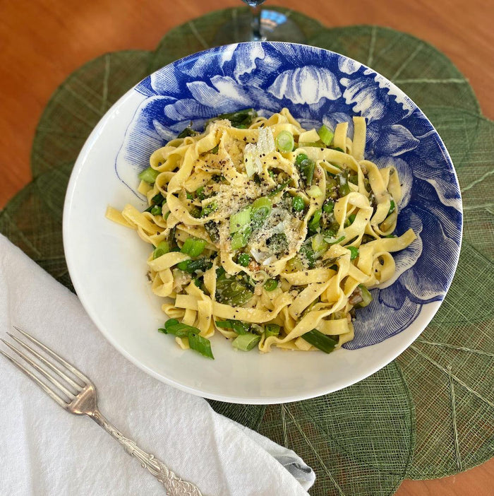 A Peony Soup Bowl holds fresh tagliatelle pasta with peas and scallions..