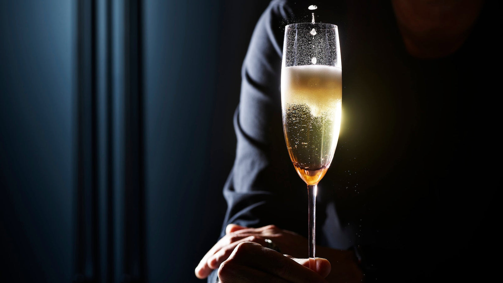 Shawn's hand with Quinn champagne flute