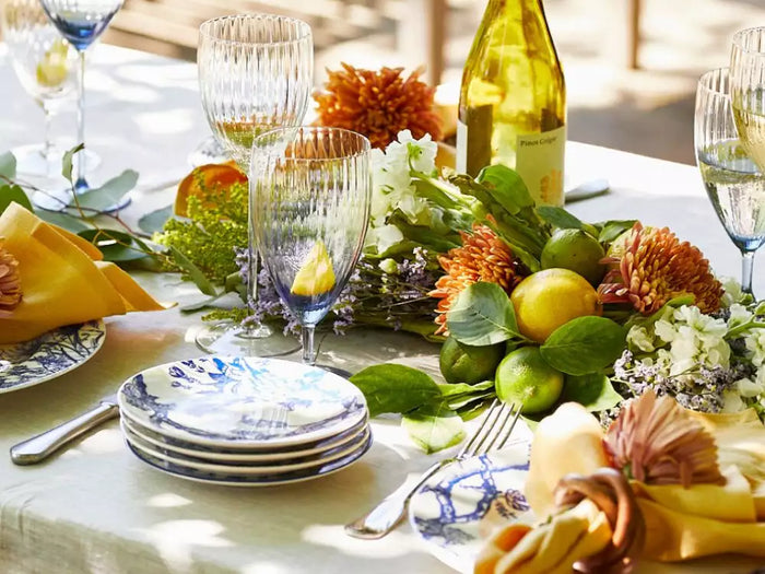 Outdoor spring table setting with Caskata blue and white dinner plates
