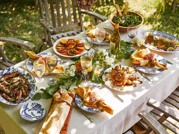 Outdoor summer table setting with blue and white porcelain dinnerware