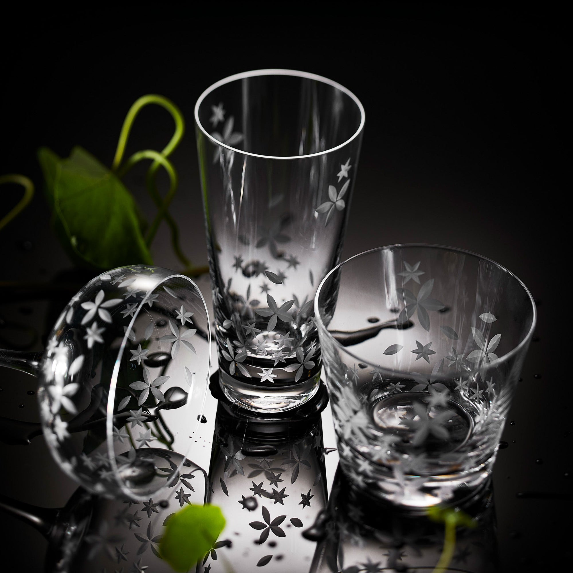 A group of glasses on a table.