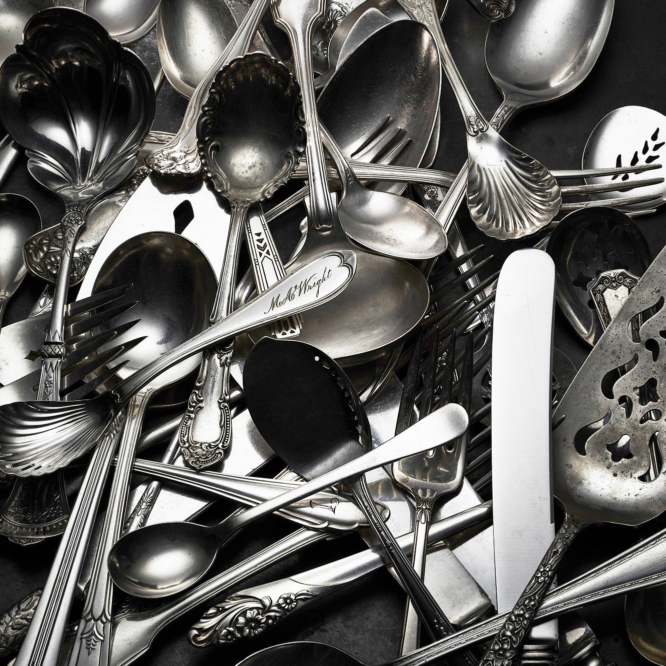 A pile of silver utensils.