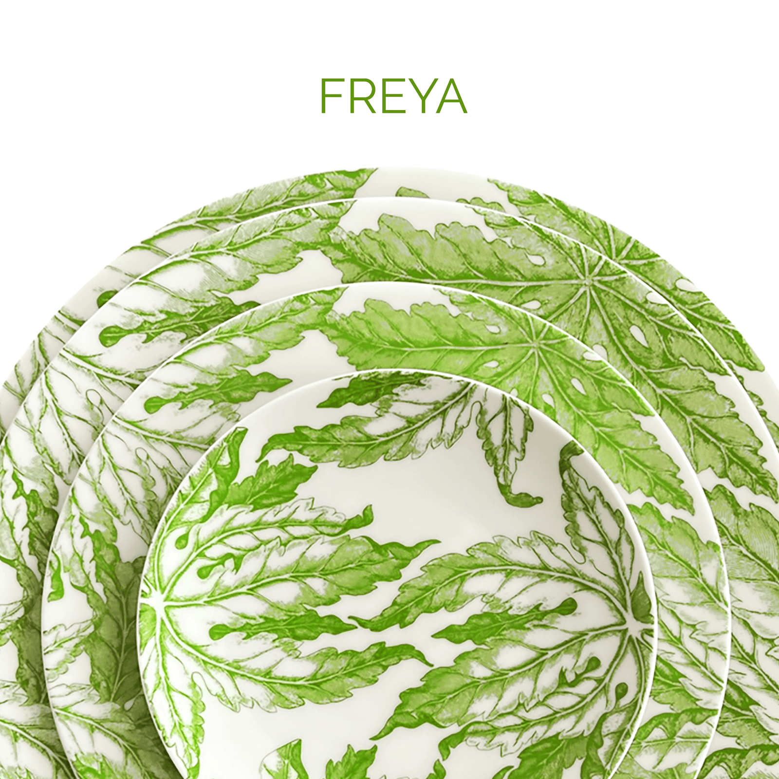 A set of ceramic plates with green leaf patterns stacked together. The word "FREYA" is written at the top.