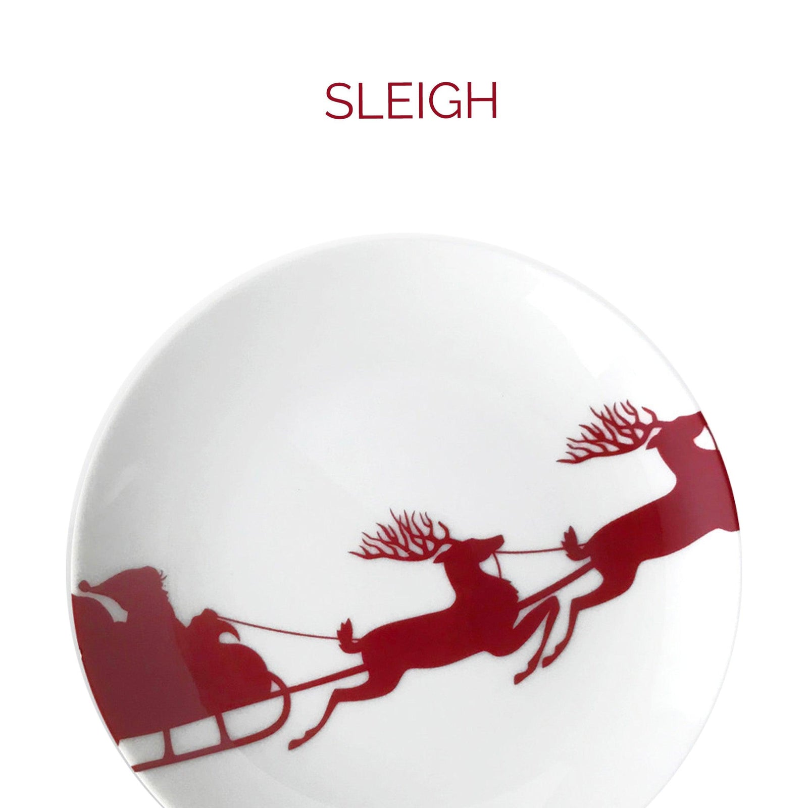A white plate with red silhouettes of a reindeer, sleigh, and Santa Claus. The word "SLEIGH" is written above it in red text.