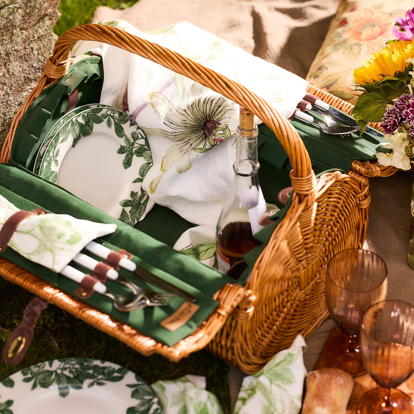 A wicker picnic basket featuring Arbor Green Rimmed Salad Plates by ...