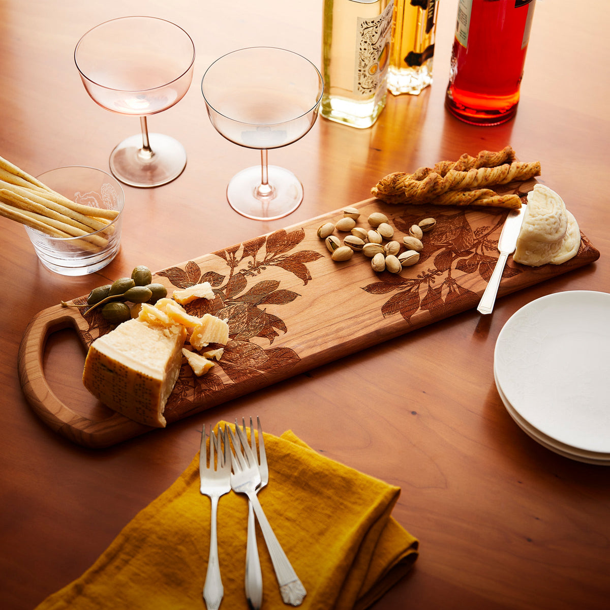 The Arbor Serving Board from Caskata makes a lovely serving pieces for evening snacks. Made in the USA from American Cherry wood.