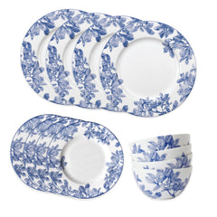 The Caskata Arbor Table for 4 is a 12-piece blue and white porcelain dinnerware set with a leafy branch design. Includes six plates and four bowls. Dishwasher and microwave safe for daily use.