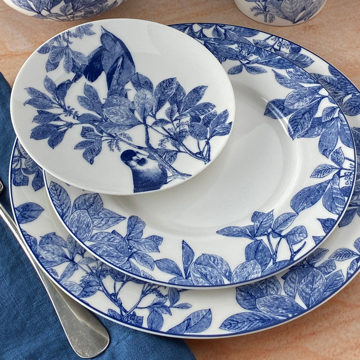 Blue and White porcelain Arbor Dinnerware from Caskata includes the Arbor birds canape plate, salad plate and dinner plate.