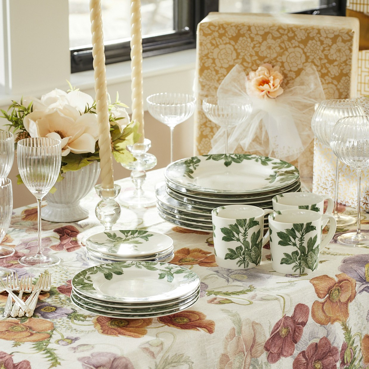 Four Caskata Arbor Green Small Plates with green leaf patterns are arranged in a semi-overlapping manner, creating a delightful botanical dinnerware display.