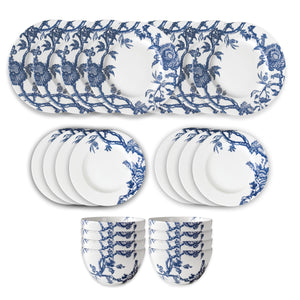 The Caskata Arcadia Table for 8 is a premium porcelain dinnerware set with white plates, side plates, and bowls adorned in blue floral patterns. Dishwasher and microwave safe—perfect for effortless everyday dining.