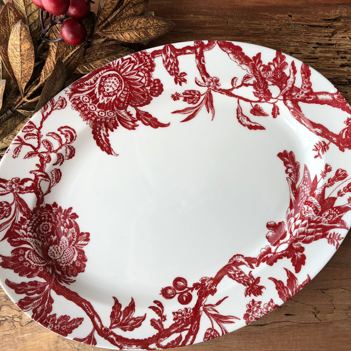 The Arcadia Crimson Large Oval Platter by Caskata is a timeless porcelain piece of heirloom quality.