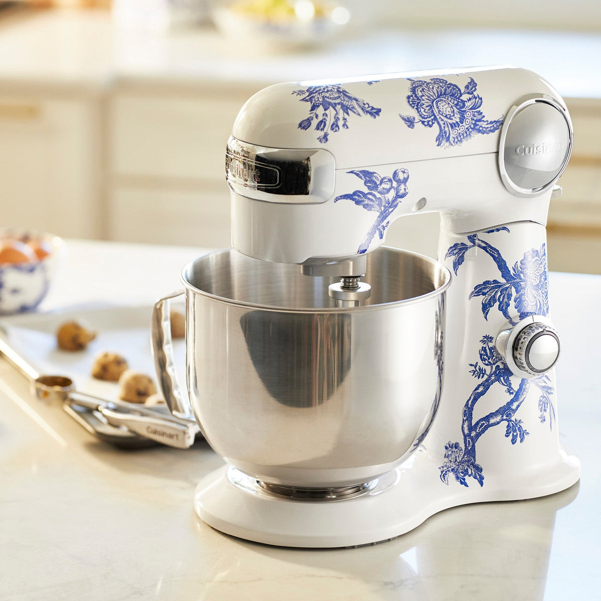 A Caskata X Cuisinart Limited Edition Arcadia Performance stand mixer, in blue and white, on a kitchen counter.
