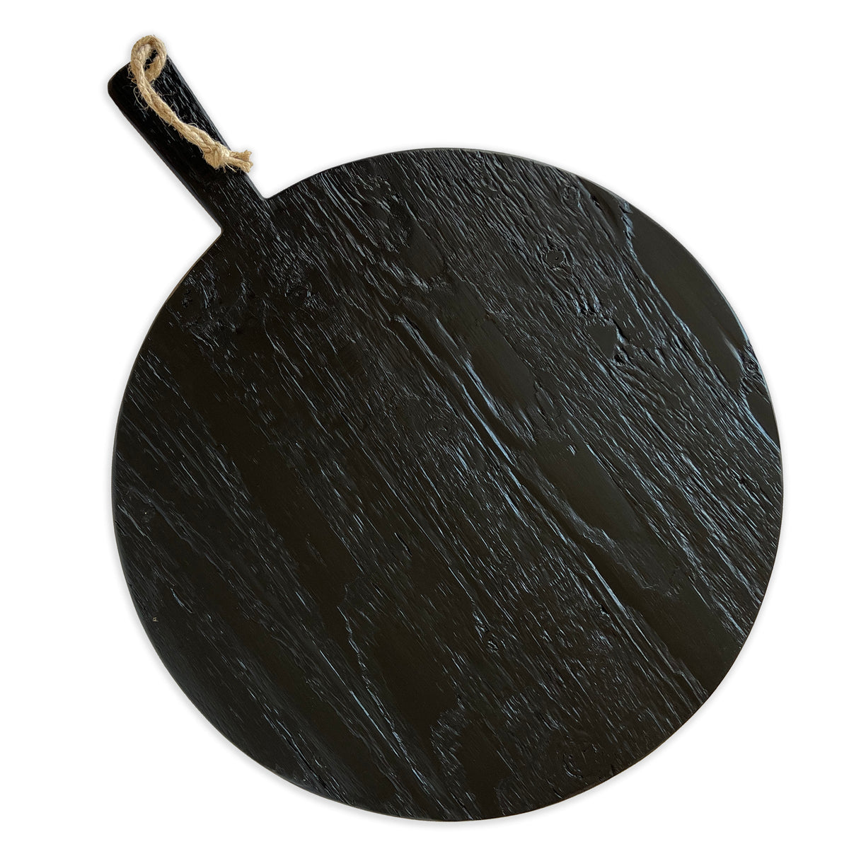Oversized Round Charcuterie Serving Board in Black with Contrasting Natural Stripes is made from reclaimed European Timbers, featuring one side with a textured finish and one side with a smooth finish, exclusively from Caskata. This image shows the textured, reclaimed side.