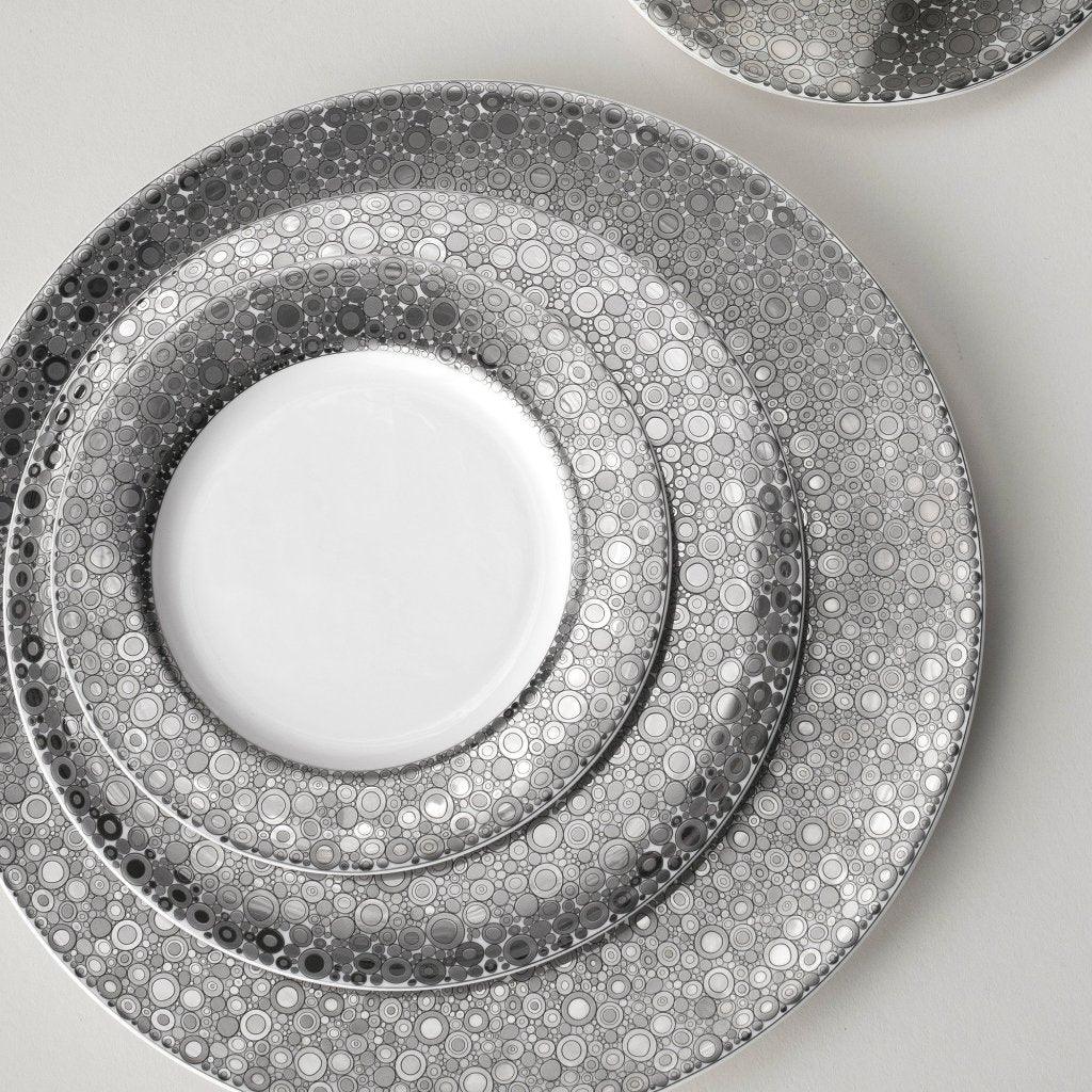 A set of Ellington Shine Platinum Bread &amp; Butter Plates with Caskata Artisanal Home on them.