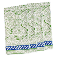 Four folded Block Island Block Print Dinner Napkins by Caskata in white, featuring a green intricate pattern and blue-white border—a charming choice for bohemian table decor.