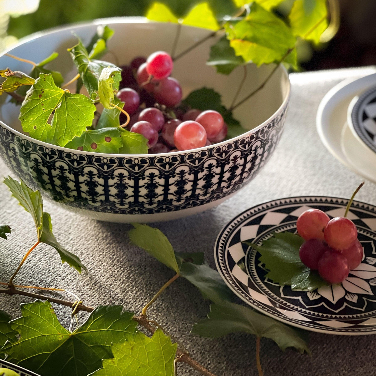 A bowl of Casablanca Vegetable Serving Bowl on a table, part of the Geometrics Collection by Caskata.